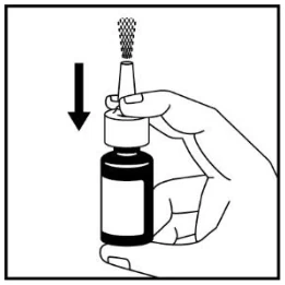 A hand holding a small bottle

Description automatically generated