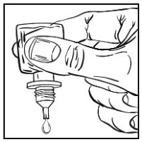 A hand holding a dropper

Description automatically generated