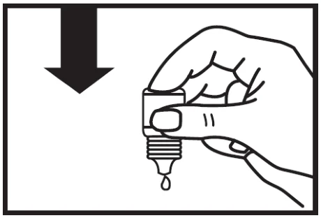 A hand holding a dropper

Description automatically generated
