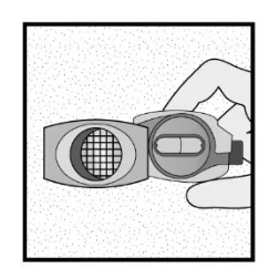 A close-up of a hand holding a device

Description automatically generated 