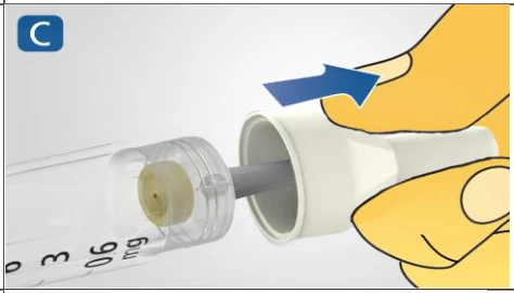 A close-up of a hand holding a tube

Description automatically generated