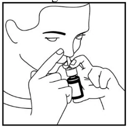 A person using a small bottle

Description automatically generated
